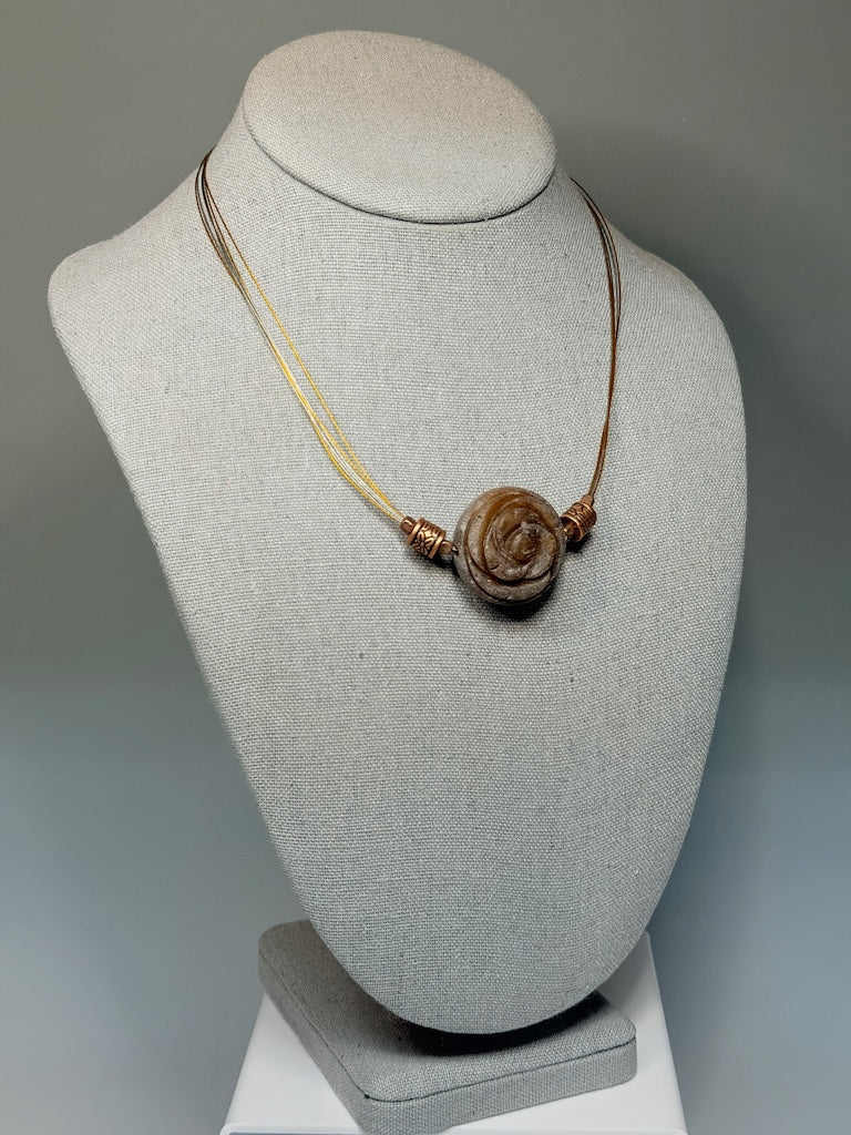 CARVED STONE FLORAL PENDANT ON STAINLESS AND COPPER NECK WIRE LCN3026