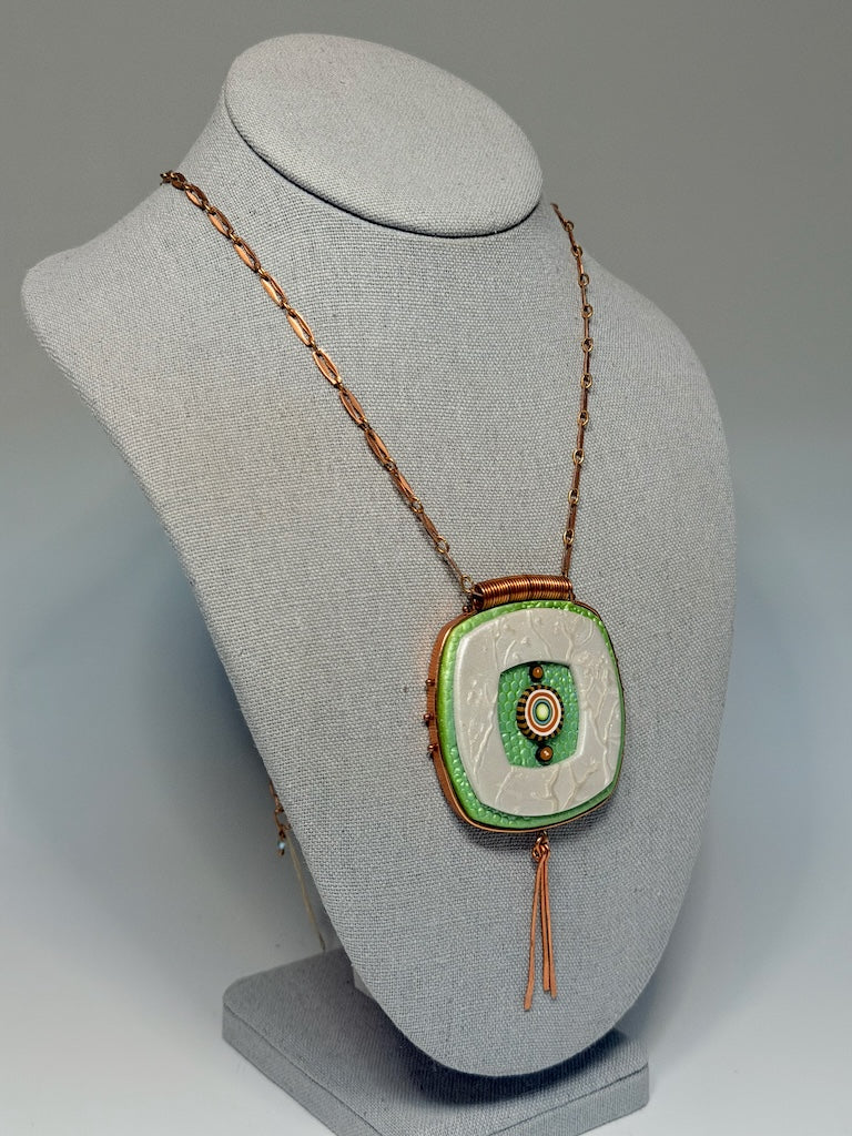 ROUNDED, LAYERED SOFT-COLORED SQUARE PENDANT WRAPPED IN COPPER WITH HAND HAMMERED COPPER PADDLE FRINGE PCN897