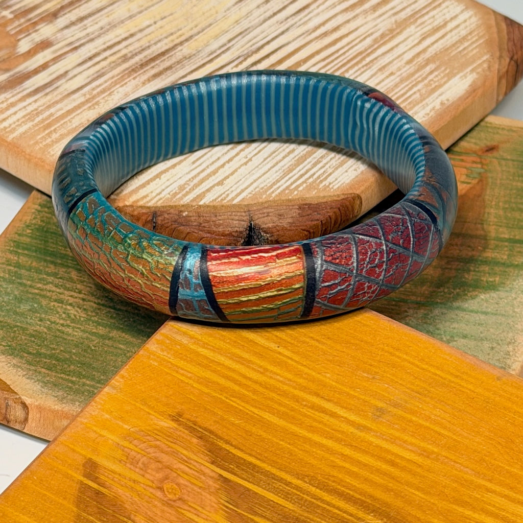 MULTI COLORED MOSAIC SLIGHTLY WAVY POLYMER CLAY BANGLE BRACELET WITH STRIPED INTERIOR PCBL872