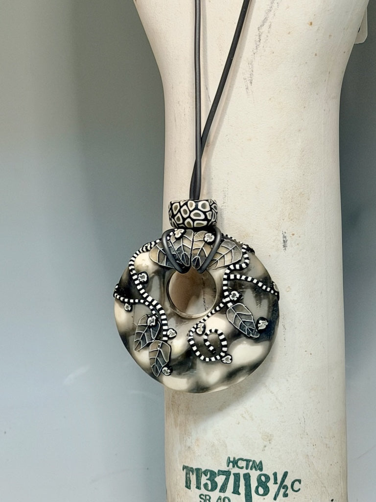 NEUTRAL COLOR ONE OF A KIND HOLLOW PENDANT WITH LEAF AND VINE DESIGN ON 30" CORD PCN896