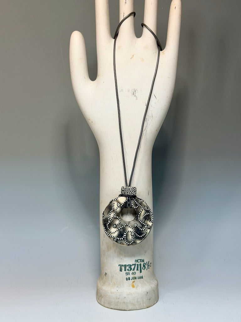 NEUTRAL COLOR ONE OF A KIND HOLLOW PENDANT WITH LEAF AND VINE DESIGN ON 30" CORD PCN896