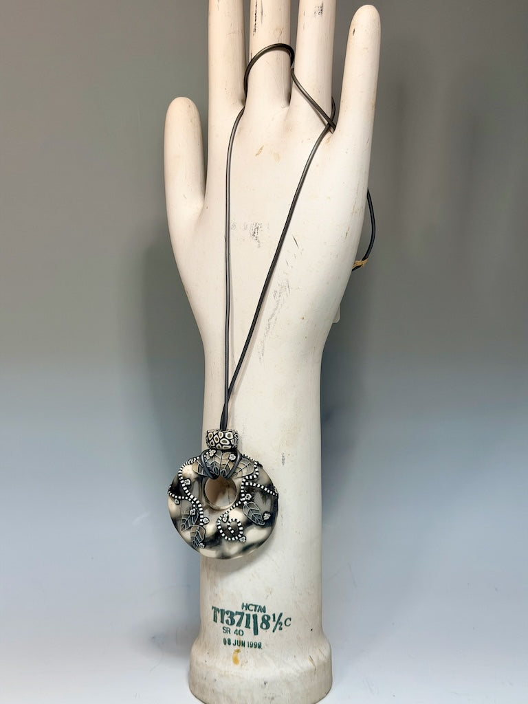NEUTRAL COLOR ONE OF A KIND HOLLOW PENDANT WITH LEAF AND VINE DESIGN ON 30" CORD PCN896