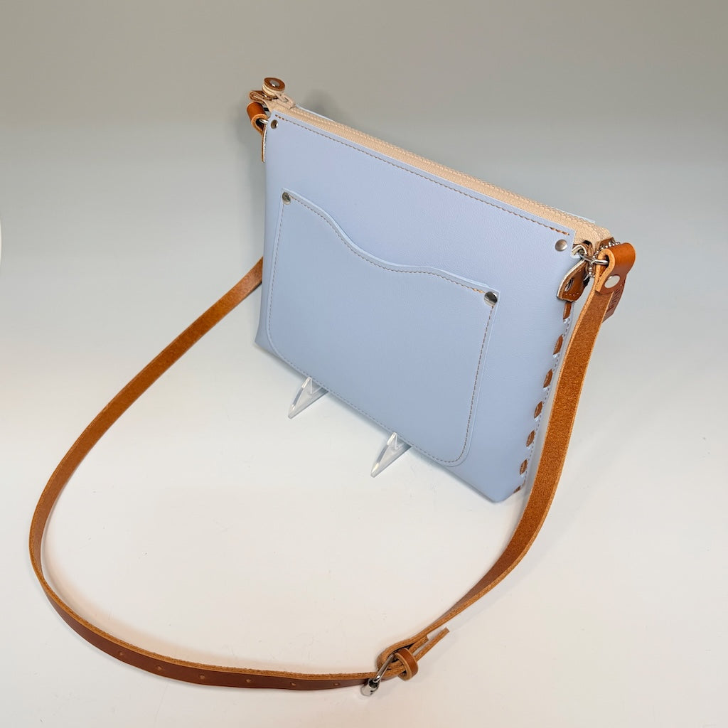 SKY BLUE LEATHER ZIP TOP BAG WITH LACED SIDES AND TAN ACCENTS - II302