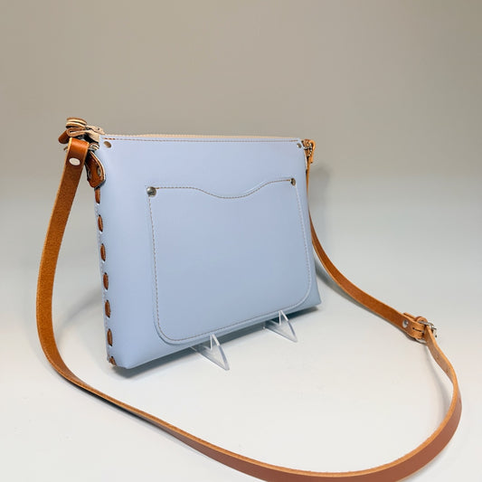 SKY BLUE LEATHER ZIP TOP BAG WITH LACED SIDES AND TAN ACCENTS - II302