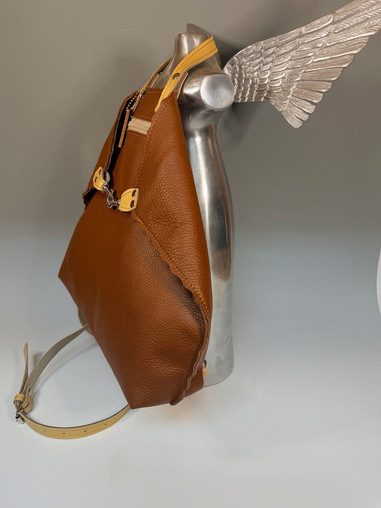 LARGE RUST LEATHER BACKPACK WITH YELLOW STRAPS, FRONT POCKET AND SCALLOPED EDGES II327R