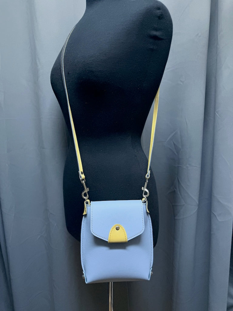 SMALL SKY BLUE LEATHER BAG WITH YELLOW TRIM AND FLAP TOP - II359