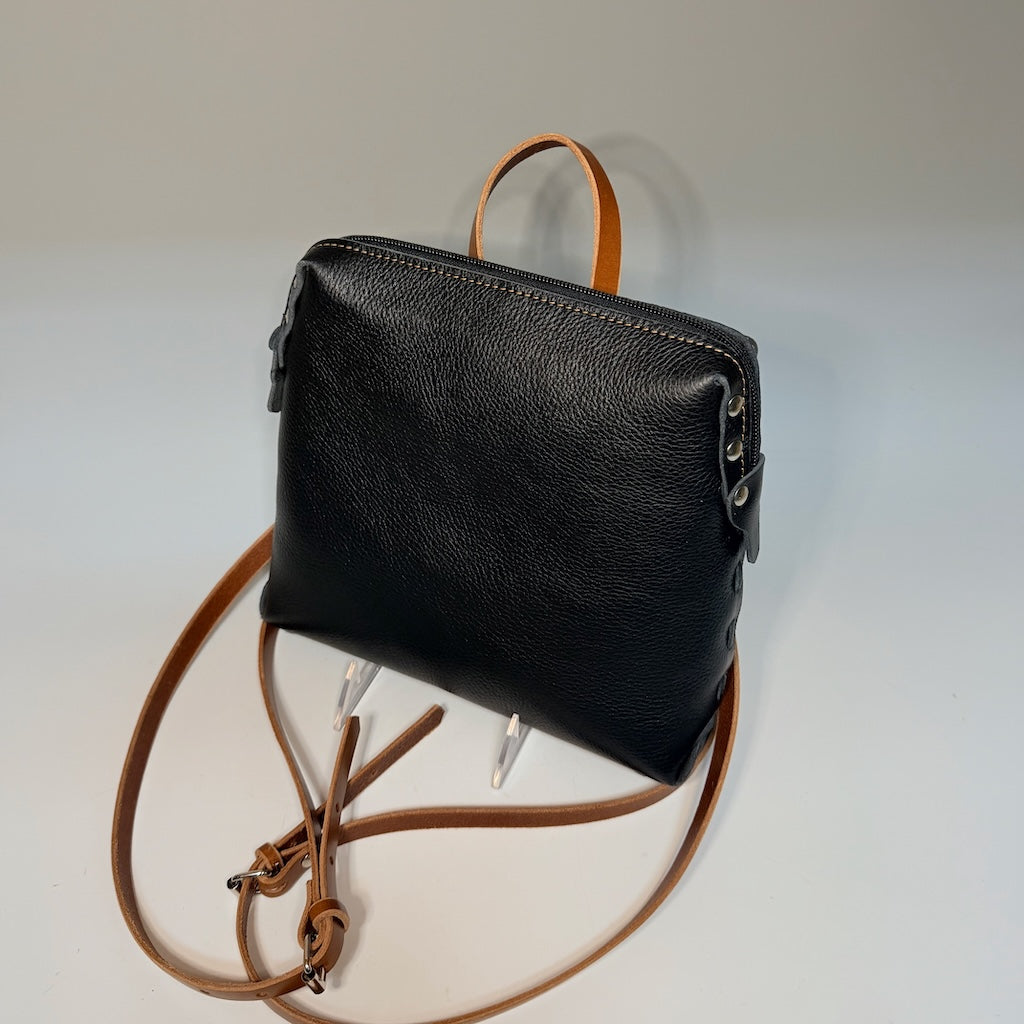 SMALL BLACK AND BROWN BACKPACK WITH RIVETS AND TOP ZIPPER II410