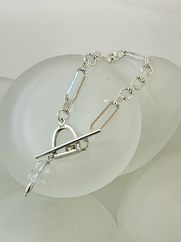 STAINLESS PAPER CLIP CHAIN BRACELET WITH STERLING SILVER TOGGLE CLASP AND CRYSTAL CHARM LCB2034