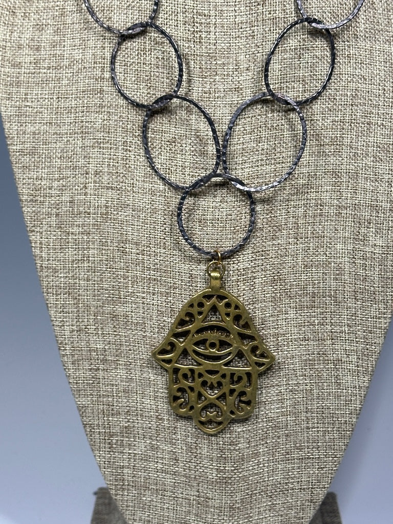 HEMATITE AND BRASS WABI SABI STATEMENT NECKLACE WITH LARGE BRASS HANSMA PENDANT LCN1087