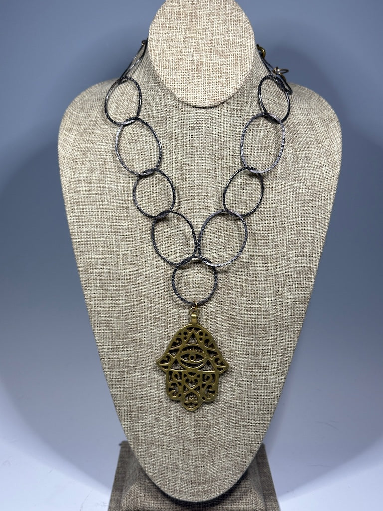 HEMATITE AND BRASS WABI SABI STATEMENT NECKLACE WITH LARGE BRASS HANSMA PENDANT LCN1087