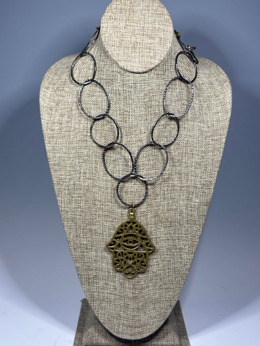 HEMATITE AND BRASS WABI SABI STATEMENT NECKLACE WITH LARGE BRASS HANSMA PENDANT LCN1087