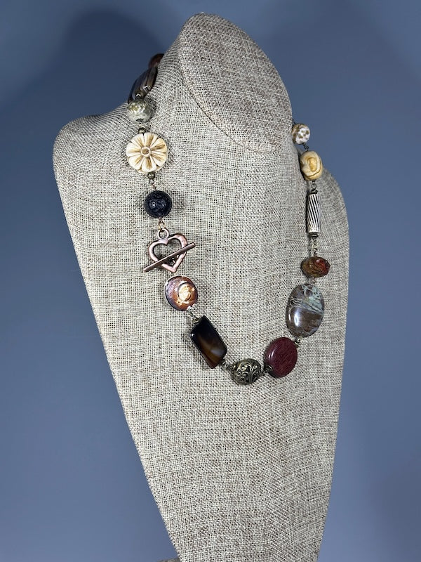 MIXED METAL AND STONE STATEMENT NECKLACE WITH COPPER HEART TOGGLE LCN1097