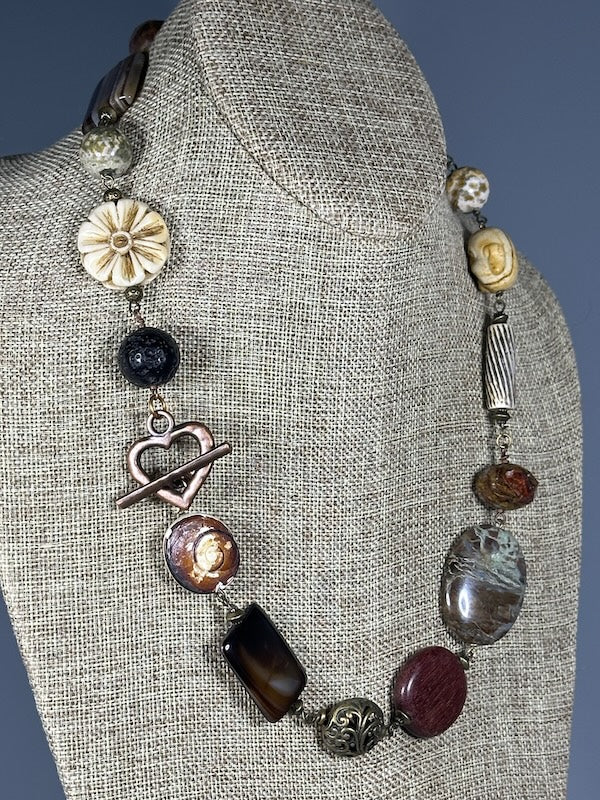 MIXED METAL AND STONE STATEMENT NECKLACE WITH COPPER HEART TOGGLE LCN1097