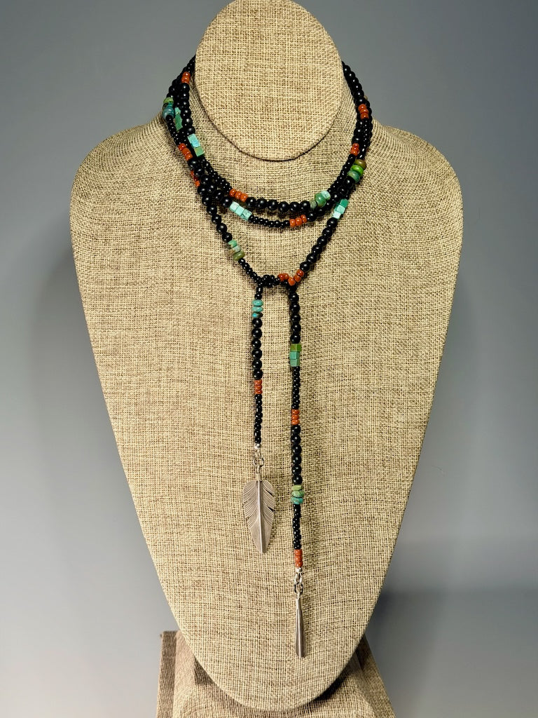TURQUOISE, CORAL AND BLACK BEAD LARIAT WITH STERLING SILVER FEATHER LCN2047