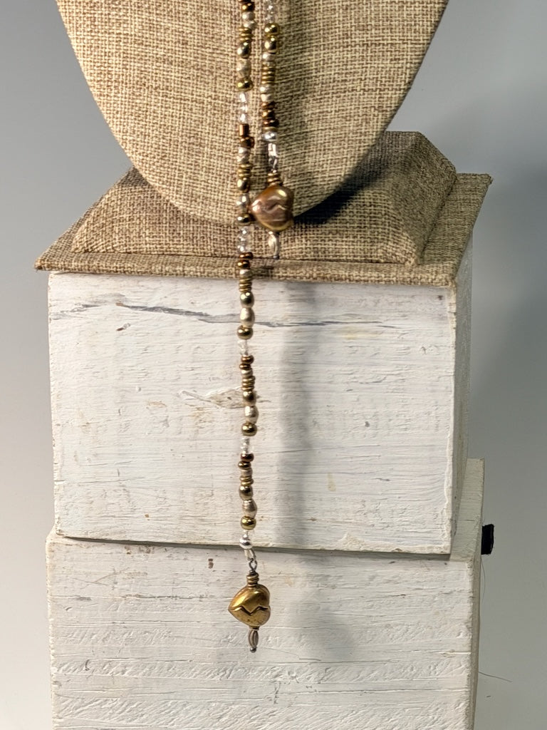 MIXED METAL AND CRYSTAL LARIAT WITH TORCHED COPPER HEART CHARMS LCN2048