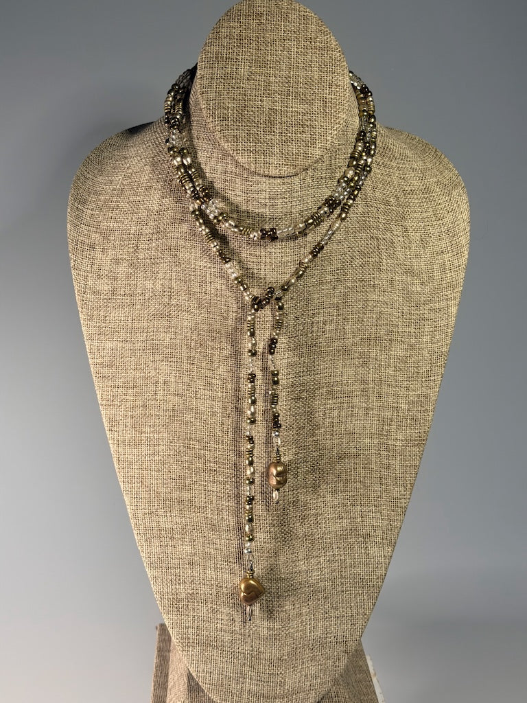 MIXED METAL AND CRYSTAL LARIAT WITH TORCHED COPPER HEART CHARMS LCN2048