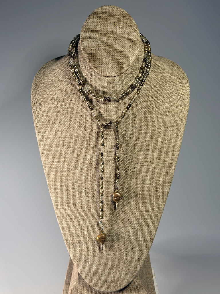 MIXED METAL AND CRYSTAL LARIAT WITH TORCHED COPPER HEART CHARMS LCN2048