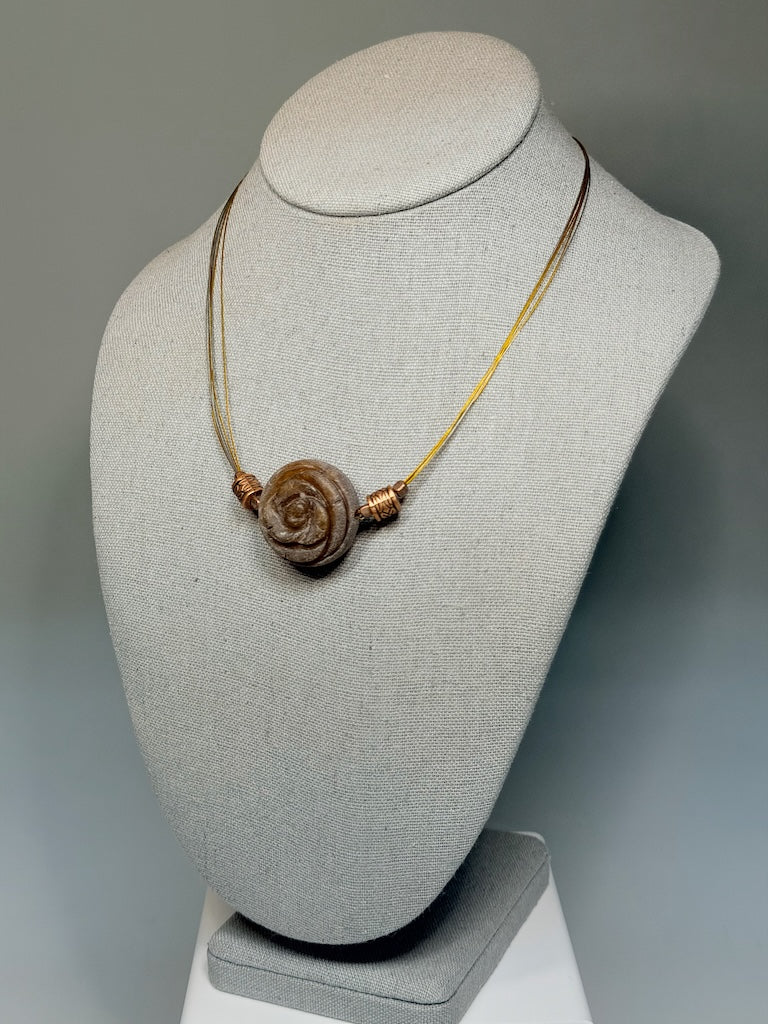 CARVED STONE FLORAL PENDANT ON STAINLESS AND COPPER NECK WIRE LCN3026