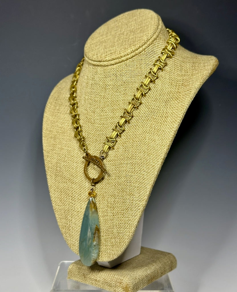 BRAIDED BRASS CHAIN WITH FRONT TOGGLE AND LARGE BLUE CALCITE PENDANT LCN656