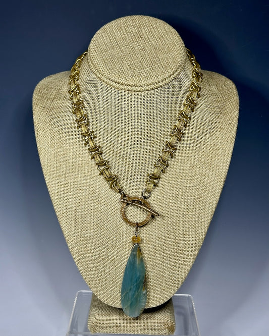 BRAIDED BRASS CHAIN WITH FRONT TOGGLE AND LARGE BLUE CALCITE PENDANT LCN656