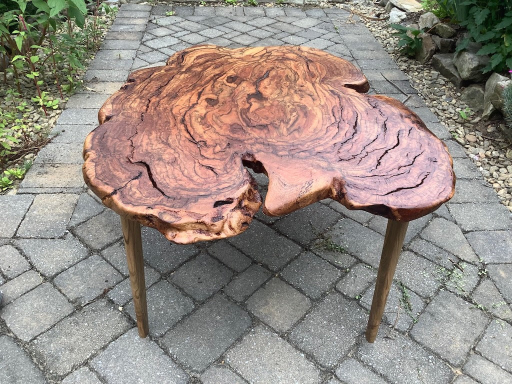 RED OAK BURL COFFEE TABLE WITH AMBROSIA MAPLE LEGS