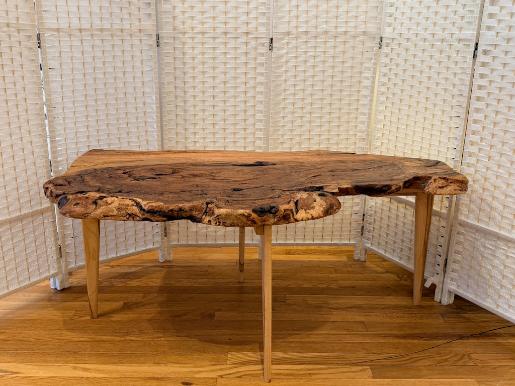 RED OAK BURL COFFEE TABLE WITH AMBROSIA MAPLE LEGS