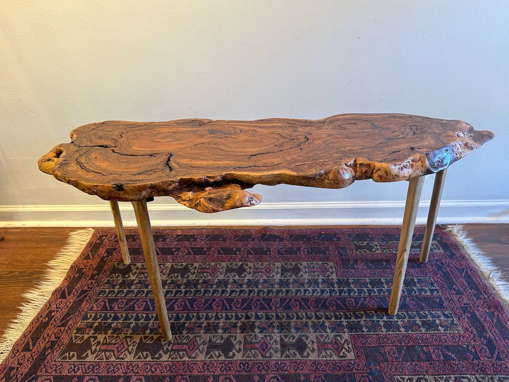 RED OAK BURL COFFEE TABLE WITH AMBROSIA MAPLE LEGS