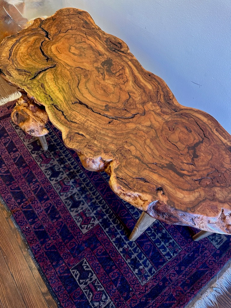 RED OAK BURL COFFEE TABLE WITH AMBROSIA MAPLE LEGS