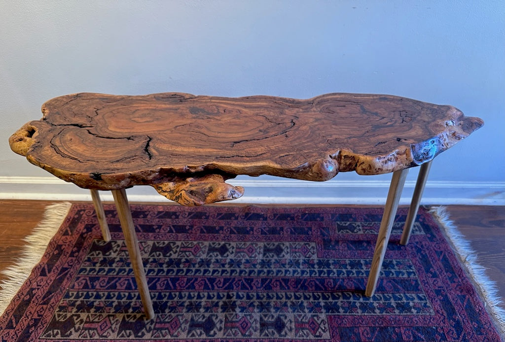 RED OAK BURL COFFEE TABLE WITH AMBROSIA MAPLE LEGS