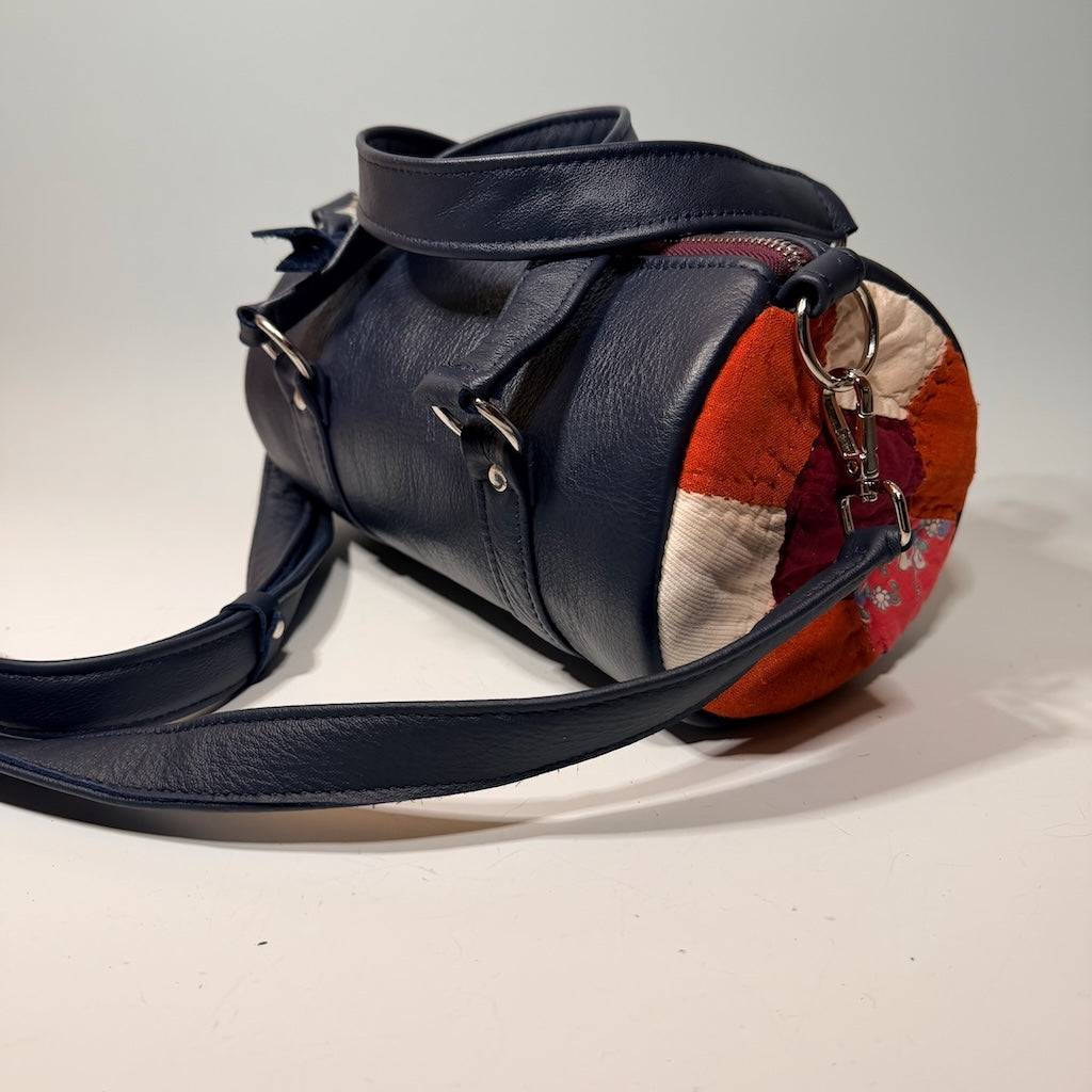 LEATHER BARREL BAG WITH VINTAGE TRIM, NAVY NH186