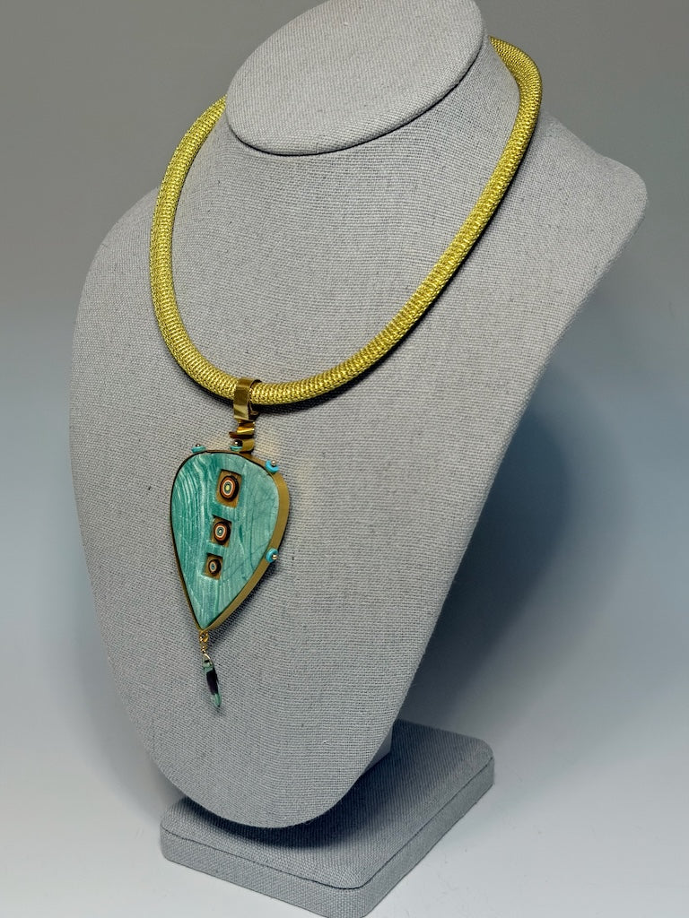 PETAL SHAPED PENDANT WITH CUT OUT WINDOWS WRAPPED IN BRASS METAL WITH GLASS DROP CHEQUE BEAD FRINGE AND TURQUOISE HESHI BEAD ACCENTS PCN900