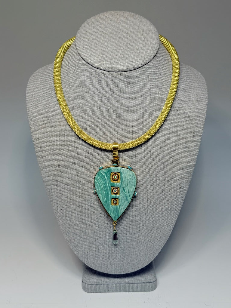 PETAL SHAPED PENDANT WITH CUT OUT WINDOWS WRAPPED IN BRASS METAL WITH GLASS DROP CHEQUE BEAD FRINGE AND TURQUOISE HESHI BEAD ACCENTS PCN900