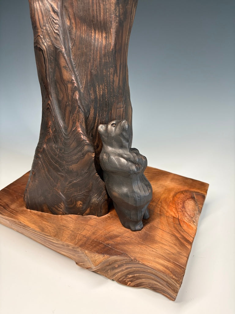 "SOLITUDE" WHITE PINE, GRAPHITE AND LEYLAND CYPRESS WOOD SCULPTURE