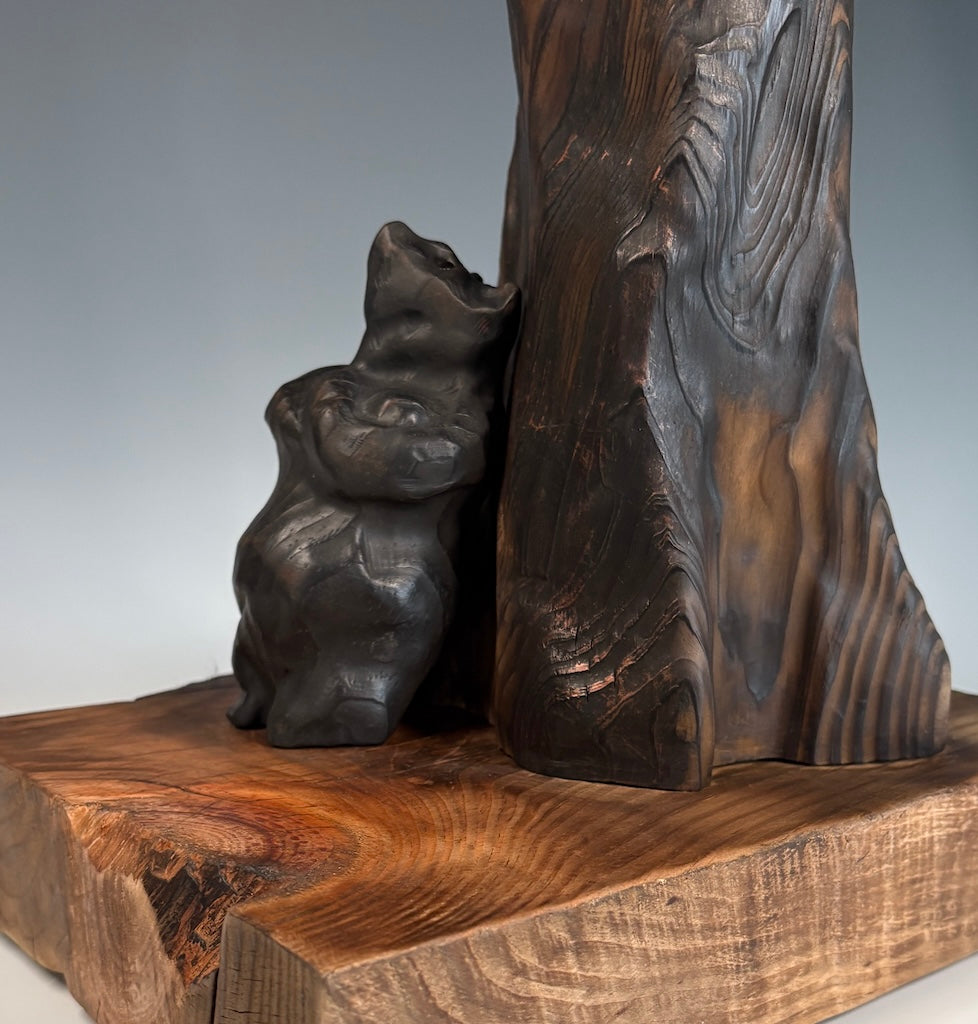 "SOLITUDE" WHITE PINE, GRAPHITE AND LEYLAND CYPRESS WOOD SCULPTURE